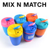 A set of reusable coffee cups in vibrant colors, featuring silicone bands and a secure lid design.