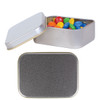A silver rectangular tin filled with colorful M&M's candies, with an open lid revealing the contents.