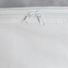 A white cooler bag with a zippered closure at the top, featuring two zip pulls and a simple design.