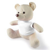 A plush bear with a beige body and a white shirt, featuring a brown nose and round ears.