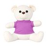 A plush calico bear in white with a purple shirt, featuring large eyes and a friendly expression.