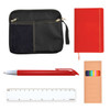 A black zippered pouch, a red notebook, a red pen, a colored pencil set, and a white ruler.