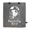 A grey tote bag made of RPET felt features a graphic of a bird and has two black handles, along with a logo.