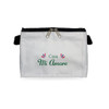A white cosmetic bag with a zip closure, featuring a front design with green and red decorative elements.