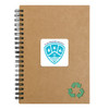 A brown spiral notebook with a green recycling symbol and a logo on the cover.