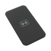 A black wireless charger with a simple design and a logo on the surface, ideal for charging devices.