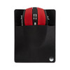 A red computer mouse tucked into a black pouch with a logo, set against a white background.