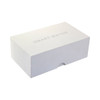 A white gift box designed for pen packaging, featuring a logo and a sleek, minimalist design.
