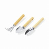 A set of three gardening tools with wooden handles and shiny metal heads, including a rake, a spade, and a trowel.