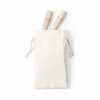 A cream-coloured pouch containing two wooden sticks, tied with a drawstring at the top.
