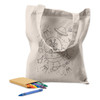 A cream-coloured tote bag featuring a line drawing of a spaceship and aliens, accompanied by colourful crayons.