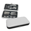 A silver and black manicure set with various tools, including nail clippers, scissors, and tweezers, in a sleek case.