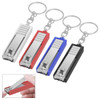 A set of four nail clippers in silver, red, blue, and black, each attached to a key ring.