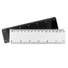A 15cm plastic ruler in white and black, featuring measurement markings on both sides and a logo.