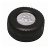A black stress relief toy shaped like a tyre, featuring a silver rim in the centre. It has a textured surface.
