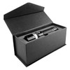 A black torch is displayed inside a sleek black gift box, featuring a textured finish and a secure closure.