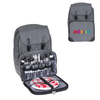 A grey backpack with compartments for drink bottles, cutlery, plates, and a checkered picnic blanket. Includes a logo.