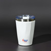 A drink bottle in white with a stainless steel bottom and a clear lid, featuring a logo on the exterior.