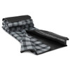 A folded picnic blanket in grey and black plaid, featuring a smooth black underside and a rolled-up design.
