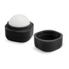 A black lip balm container featuring a rounded, white top. Includes an outer casing and a removable lid.