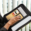 Sakura Cork Portfolio in black with a cork interior and organisational compartments, featuring a logo.