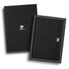 A black notebook with a leather-like cover presented in a stylish black gift box, featuring a logo.