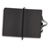 A black notebook with blank pages, featuring a ribbon bookmark and cover. It has a logo on the front.