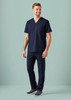 A navy scrub top and matching scrub pant; features a pocket and a logo on the chest.