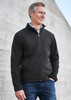 A men's soft shell jacket in black, featuring a zip front and side pockets, modelled by a man.