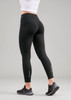 A pair of black women's leggings with a high waistband, featuring reflective accents on the lower legs.