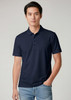A navy short sleeve polo shirt featuring a collar and a branded logo. Model wears it with light blue jeans.