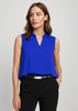 A sleeveless, layered blouse in bright blue, featuring a v-neckline, paired with black pants. The model has a polished look.