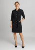 A black dress with a belted waist, button-down front, and two chest pockets, featuring rolled sleeves.