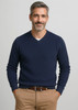 A navy knitted jumper featuring a V-neck design, worn by a smiling man with grey hair.