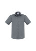A grey short sleeve button-up shirt with a pocket and a collar, featuring a logo on the label.