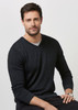 A black Merino pullover sweater is displayed being worn by a man, featuring a V-neck and long sleeves.