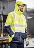 A waterproof jacket in high visibility yellow and navy, featuring reflective strips and a hood. It has a logo.
