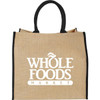 A large jute tote bag in natural colour with black handles and a logo on the front.