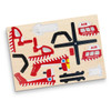 A wooden puzzle featuring red and black helicopter and ambulance shapes, set against a light wooden background.