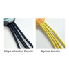 A close-up of two types of cables: black high elastic fabric and yellow nylon fabric, both featuring textured finishes.