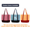 Three large canvas tote bags displayed: one pink, one blue, and one orange, each with a dark base and a logo.