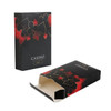 A black playing card box featuring red and black card suit designs, partially open with a logo on the front.