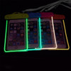 Four waterproof phone bags in vibrant colours, featuring fluorescent outlines and interlocking closures, each holding a phone.
