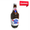 A large inflatable drink bottle in brown, red, white, and blue, with a logo featured on the front.