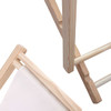 A wooden beach chair featuring light timber framing and a fabric seat. The image captures close-up details of its structure.