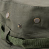 A green outdoor brim hat featuring metal snap buttons and a woven band for added style.