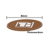 A brown oval PVC coaster featuring a logo, measuring 82mm in diameter and 5mm in thickness.