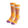 A pair of vibrant orange socks with purple and white stripes and a towel bottom design. The socks feature a logo.