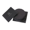 A set of black slate coasters stacked together, featuring a logo on one coaster.
