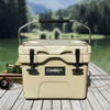 A 15L cooler box in beige, featuring a metal handle and a logo, positioned on a wooden surface by a lake.